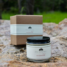 Load image into Gallery viewer, a clear glass jar of unscented hand cream sits on a forest boulder with the kraft gift box behind