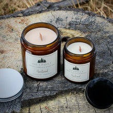 Load image into Gallery viewer, Heartwood scented beeswax candle in amber glass jar with wooden wick.