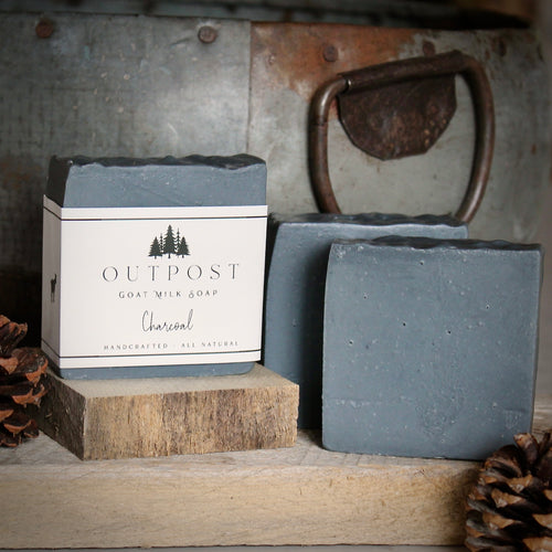 dark gray bar of activated charcoal goat milk soap