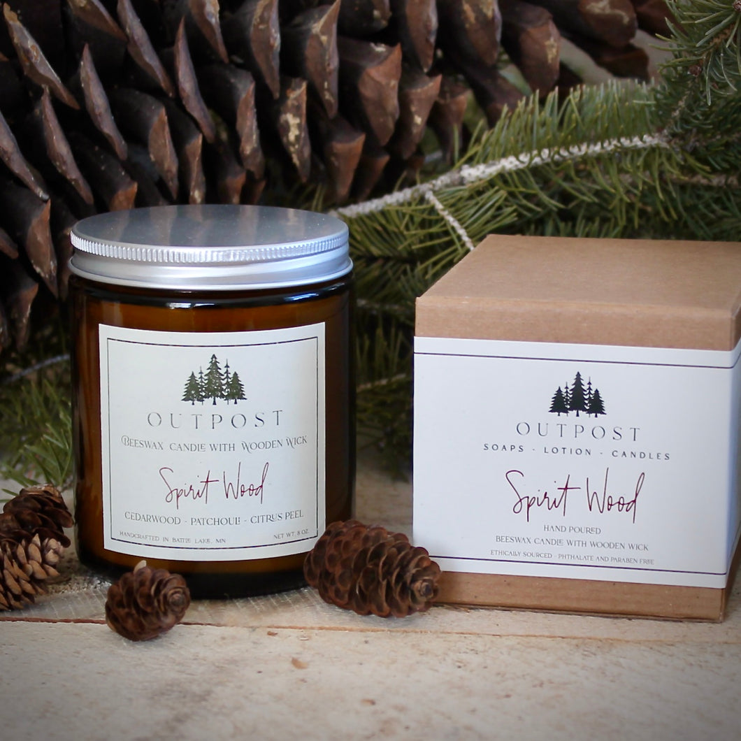 8 oz candle in amber glass jar with silver metal lid and gift box.