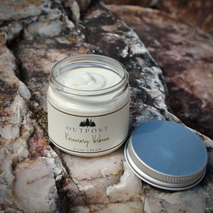 rosemary verbena hand cream shown with metal lid removed  revealing a creamy soft lotion.