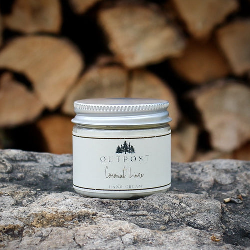 Coconut Lime hand cream in clear jar with metal lid
