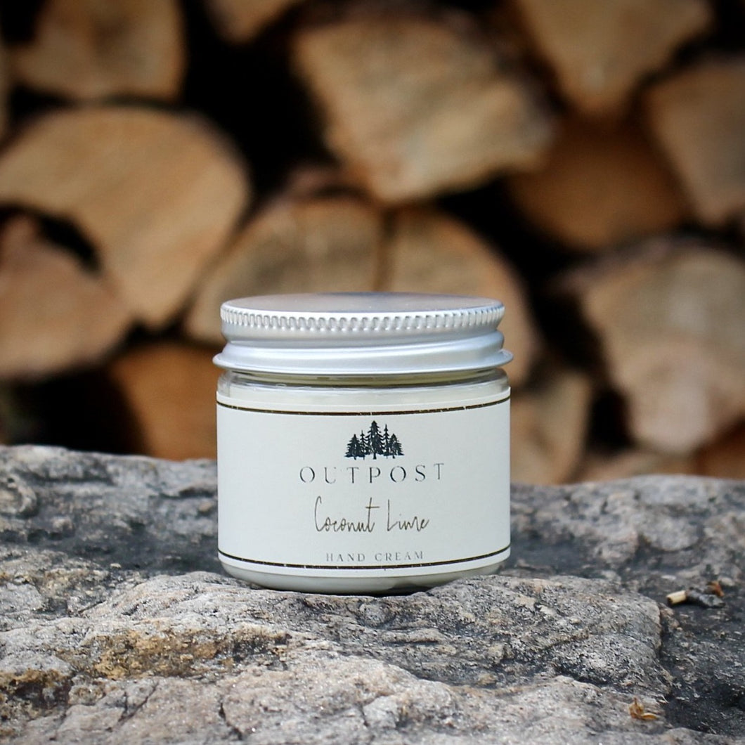 Coconut Lime hand cream in clear jar with metal lid